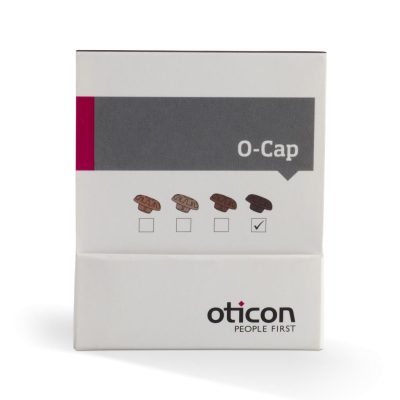A white Oticon O-Cap box displays four illustrated brown caps, one with a checkmark. The "Oticon O-Cap" name and the slogan "People First" appear at the bottom.